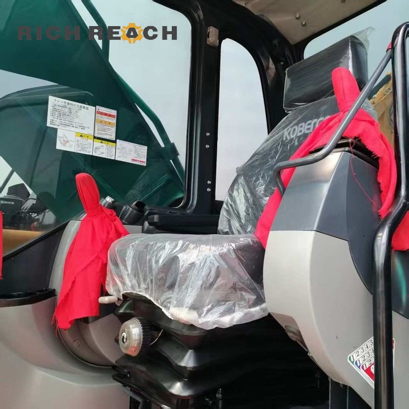 Cab interior and multifunctional monitor of a 2017 Kobelco SK350LC excavator, priced at $34,722
